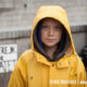 Climate 2020 | Photo portrait of Greta Thunberg in yellow sou'wester, hood up looking directly at you - credit Anders Helberg | Effeckt
