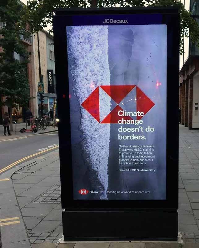 HSBC Advert banned by ASA. Photo of ad in bus shelter on an urban street. Photo courtesy of Adfree Cities addfreecities.org.uk
