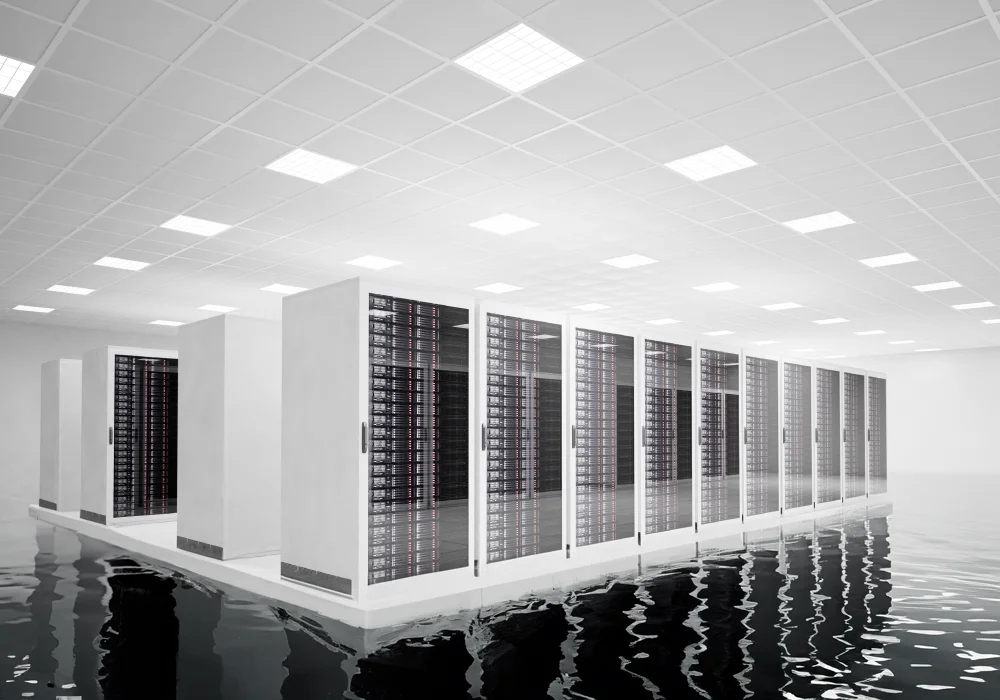 Servers in a brightly lit room surrounded by water.