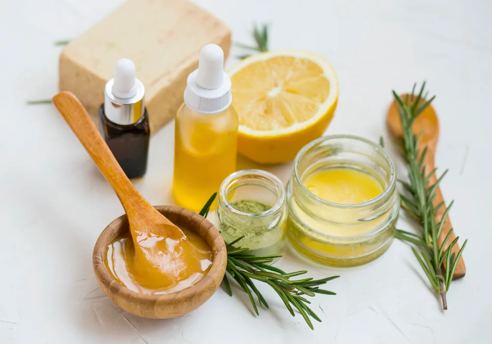 natural-products-greenwashing Natural skincare ingredients with manuka honey, lemon, essential oil, clay, balm, rosemary herbs and natural soap.