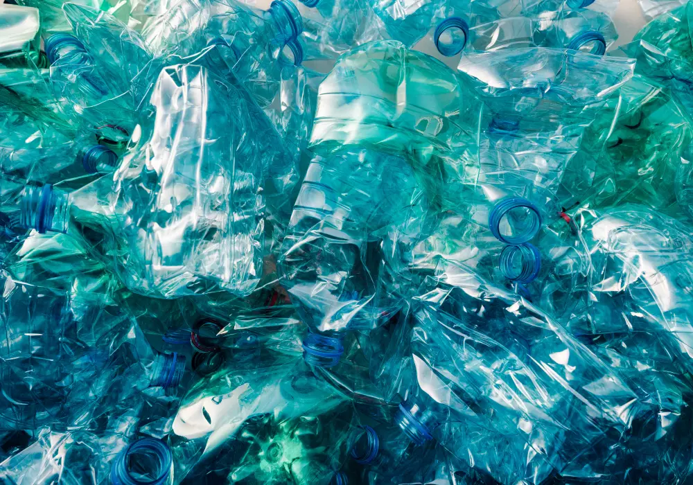 A pile of empty blue plastic bottles.